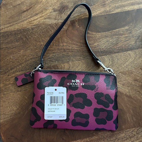 Coach Handbags - Coach Fuchsia and Black Leopard Wristlet 6” long